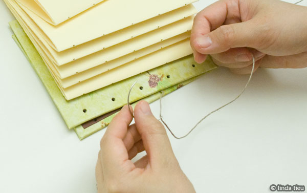 koptische binding - eerste katern aan kaft naaien